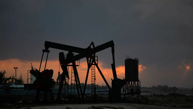 Oil around $80 as dollar strengthens