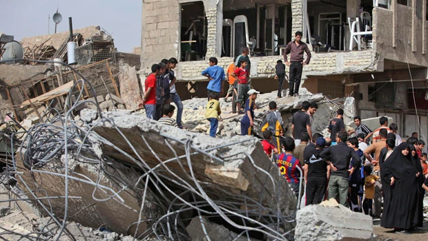 Iraqis defy intimidation to vote, attacks kill 26