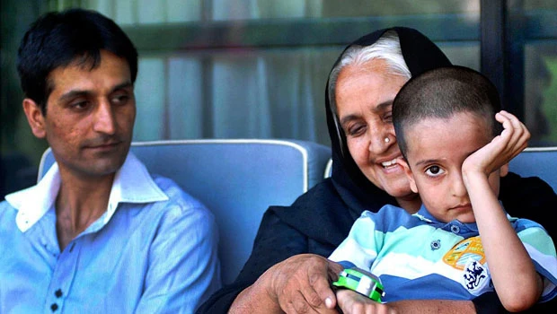 Freed British boy flies home after reunion with family