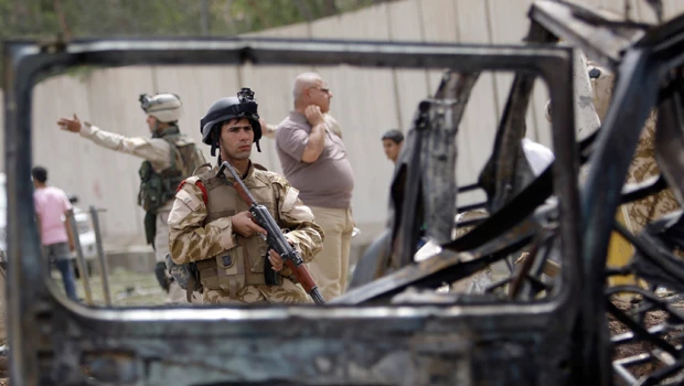 Suicide car bombers kill 30 in central Baghdad