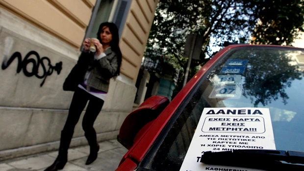 Greece clears first debt hurdle, but doubts remain