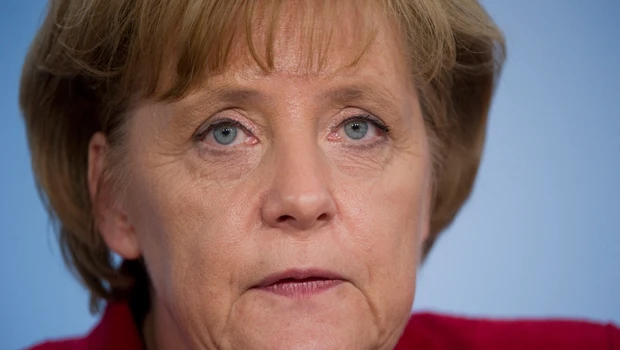 Merkel demands faster global bailout for Greece