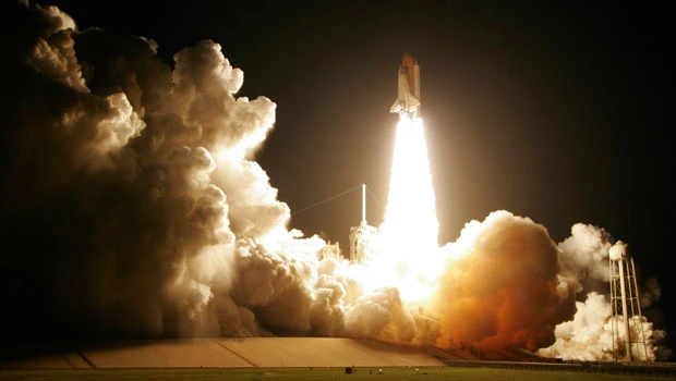 Discovery, astronauts blast off