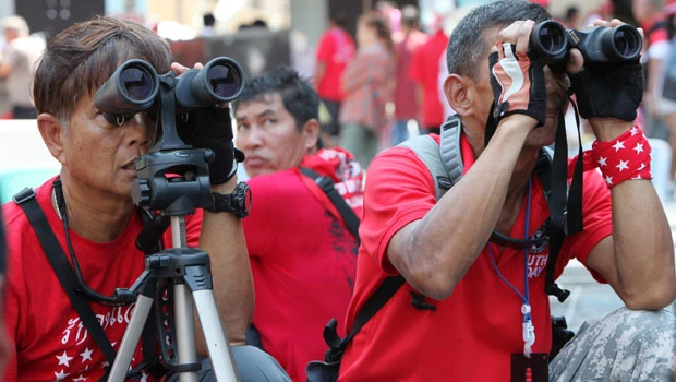Thai red shirts regroup, say action after 2 days
