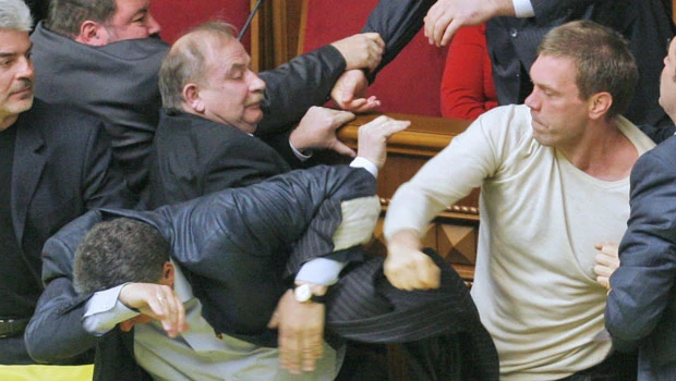Ukraine parliament hit by brawl, eggs, smoke bombs