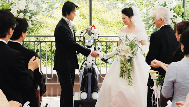 Knot a bad idea: Flashing eyes, robot conducts wedding in Tokyo