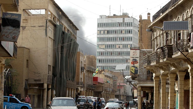 12 killed in bomb, gun battle at Iraq central bank
