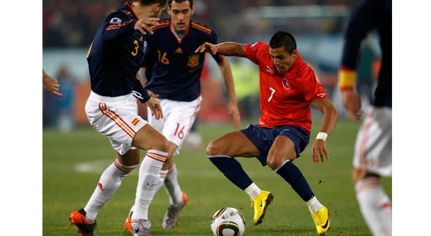 Chile loses to Spain but makes it to last 16