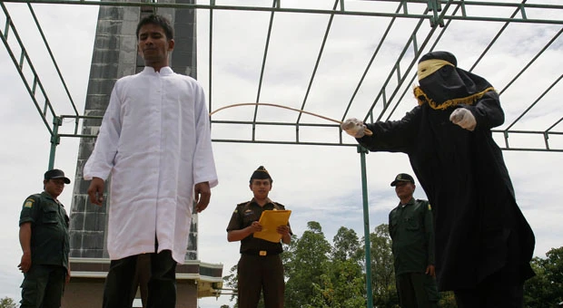 Islamic authorities cane 4 gamblers in Aceh