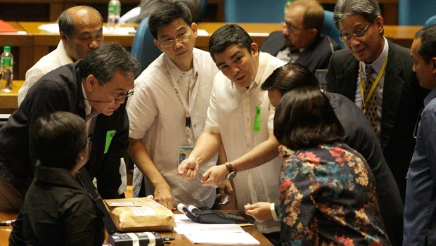 Philippines' Aquino takes a break from waiting game
