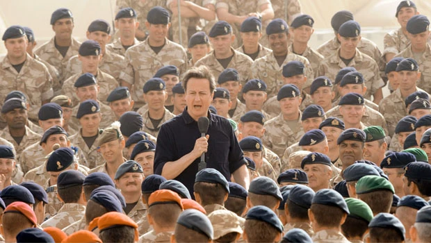 UK premier tells troops they will leave once Afghans ready