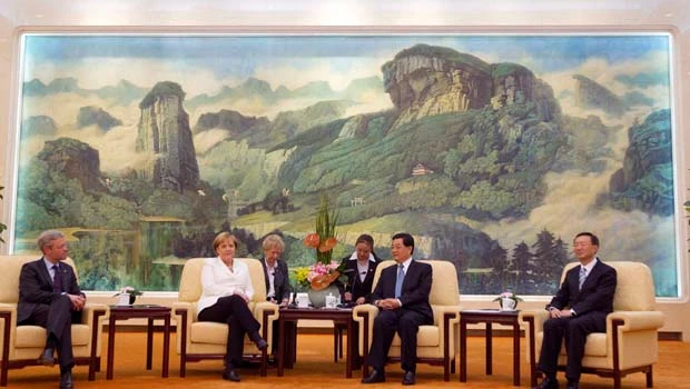 Merkel urges China to open up markets