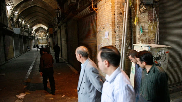 Protests simmer among Iran's powerful merchants