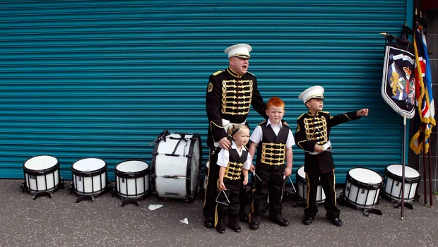 Orangemen march after Belfast riot; 27 police hurt
