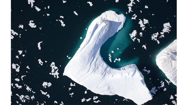 Huge ice island calves off Greenland glacier