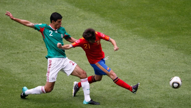 Out-of-shape Spain salvages draw vs. Mexico