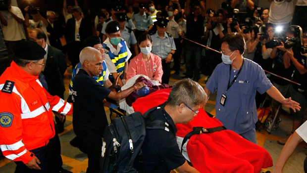 Hong Kong victims of Manila bus hijacking return home