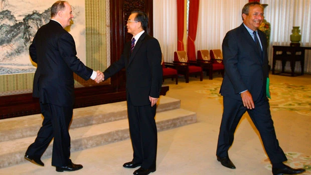 China rejects currency pressure amid US visit