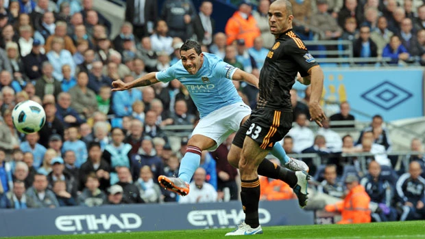 Man City halts Chelsea charge with Tevez winner