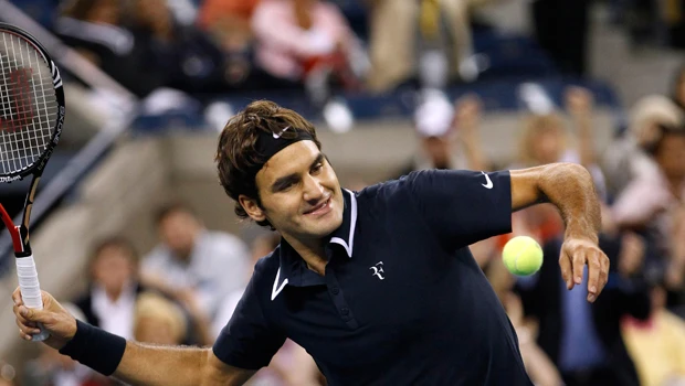 Federer defies wind and Robin at US Open
