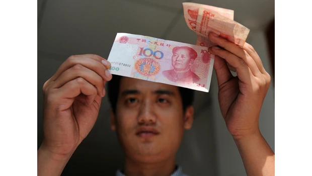 China raises key rate for 1st time since crisis