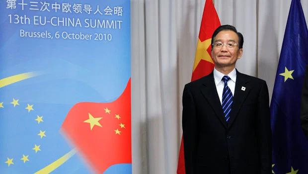 China tells EU to stop pressing on currency