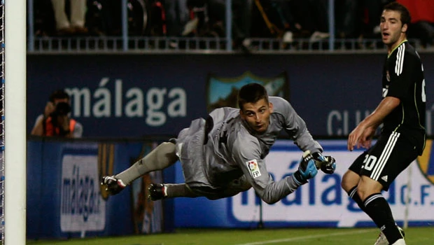 Madrid tops with Malaga win; Barca beats Valencia