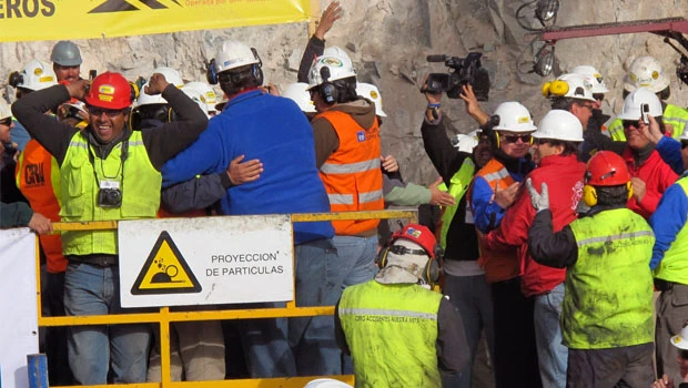 Cheers, tears as rescue shaft reaches Chile miners