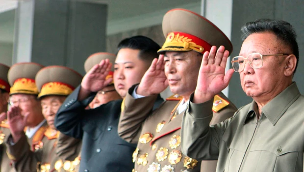 NKorea’s Kim, heir apparent son at lavish parade