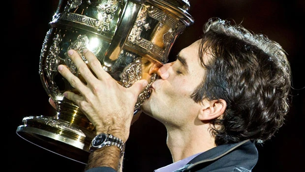 Federer regains crown at home