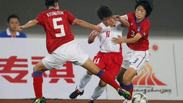 Old Asian rivalries spill pitchside at Games
