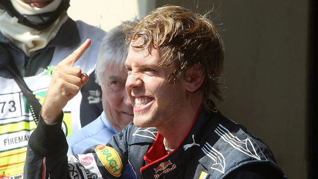 Vettel wins to keep title race alive