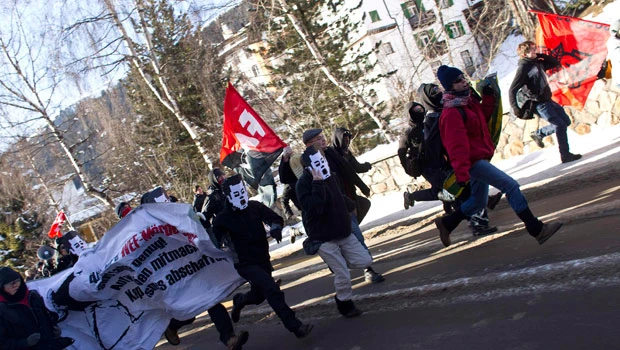 Anti-capitalists clash with riot police in Davos