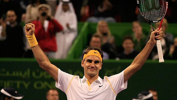 Federer downs Davydenko to claim Qatar title