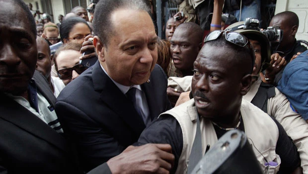 Haitian police take ex-dictator to court