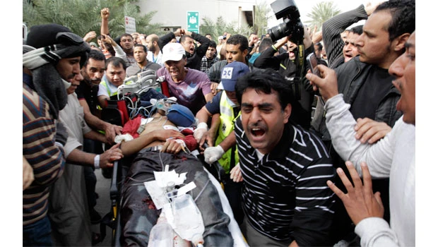 Bahrain police break up protest camp, four killed