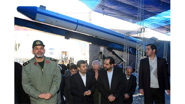 Iran unveils missiles, satellites