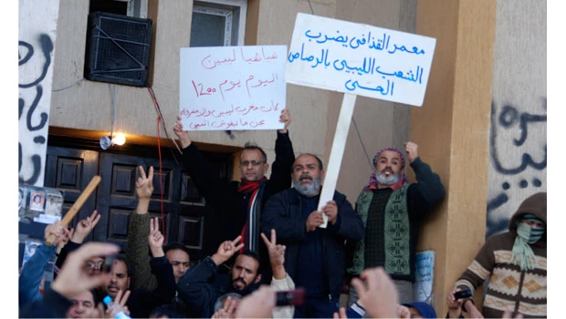 Clashes erupt in Tripoli; protesters celebrate in Benghazi