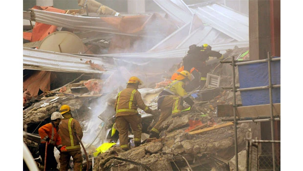 Dozens trapped by New Zealand quake that killed 65