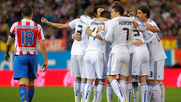 Real win Madrid derby to keep pace with Barca