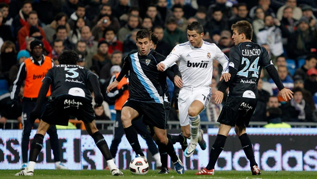 Madrid routs Malaga to peg back to Barca