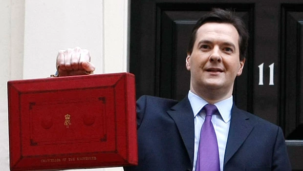 Britain cuts growth forecast in budget