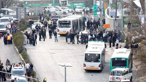Bombing near Jerusalem bus stop kills woman, 30 hurt