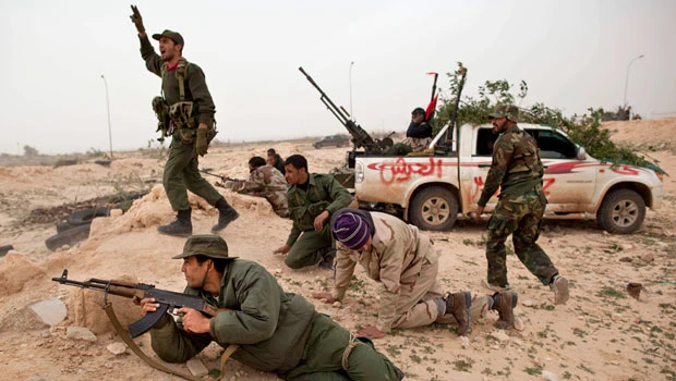 37 killed in Libya as Qaddafi forces battle rebels