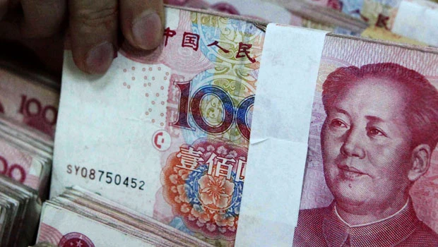 China turns to currency to cool inflation