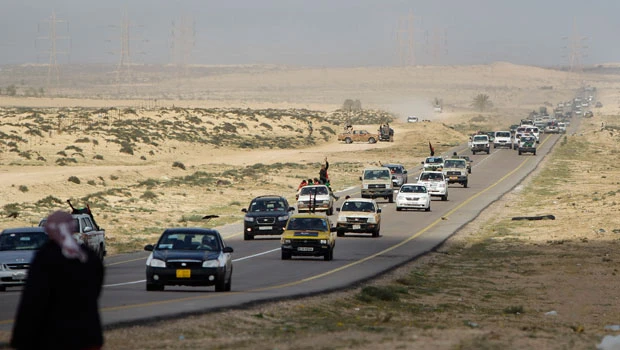 Rebels fight see-saw battle with Qaddafi forces in key oil town