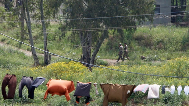 Syria sends more troops to besieged southern city