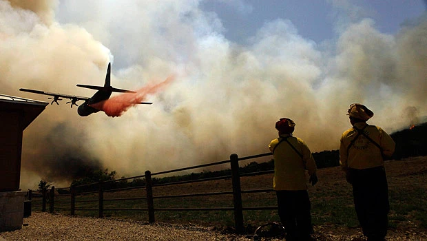 Wildfire evacuees keep tabs on homes from afar