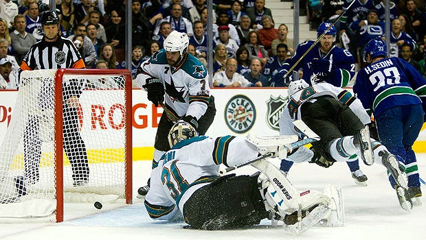 Canucks rally to beat Sharks in Game 1