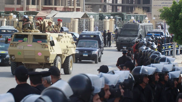 Trial of Egypt’s former security chief postponed after scuffle